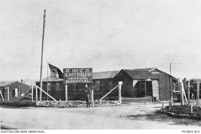 Wimereux, France. c. 1917. The entrance to No. 2 Australian General Hospital (2AGH) at Wimereux, near Boulogne which had a critical role in evacuating the sick and wounded from the front back to England. 2AGH was a very large hospital, expanding from 520 beds to 1900, which were housed in 1300 huts and 600 tents. 